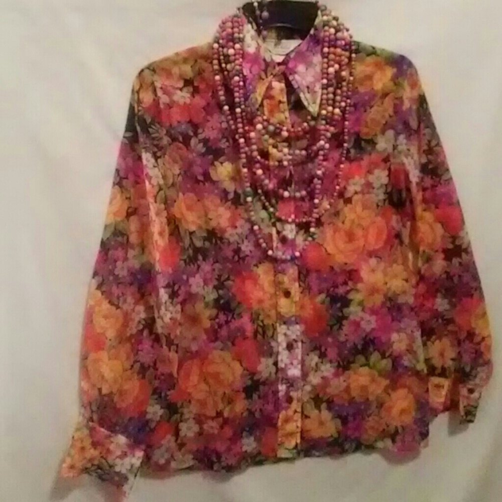 This is a Vintage 1960's flower child blouse